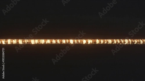 A video shows glowing lights on a dark background with motion