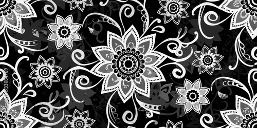 Intricate floral pattern in grayscale with swirling decorative elements