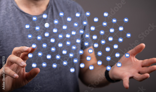A person holds a digital ne...