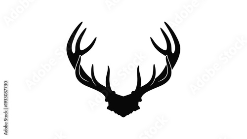 Black silhouette of a large set of deer antlers showing multiple points and a symmetrical design on a white background.