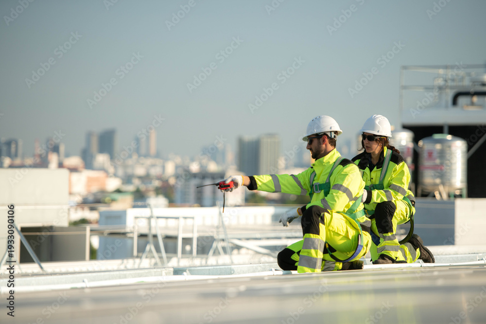 Fototapeta premium Engineering team installing and inspecting rooftop solar panels
