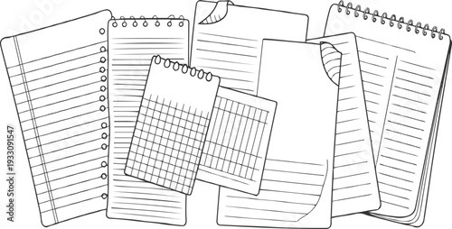 Assortment of lined and gridded paper sheets and notebooks with spiral bindings