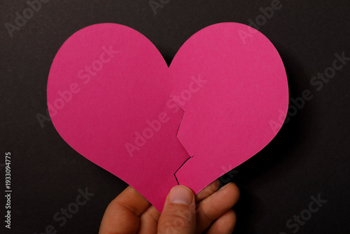 A pink heart cut in half, h...