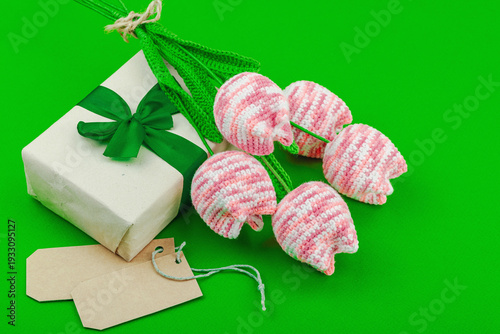 Handmade crochet tulip bouquet with wrapped gift box. Creative spring holiday present, artisan craft