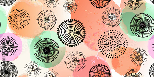 Abstract arrangement of swirling circles and dotted patterns on a colorful background