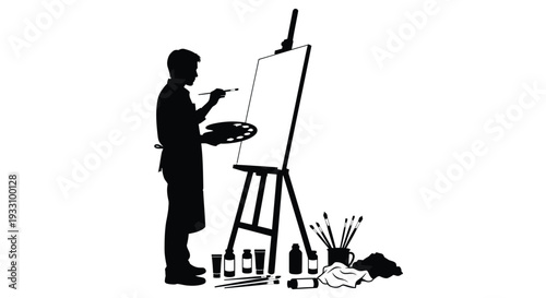 Artist painting at an easel focused creativity in black silhouette