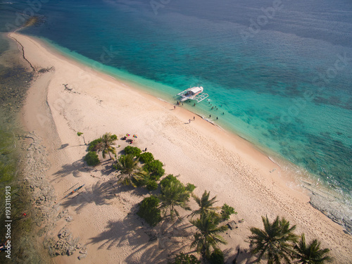 Wallpaper Mural Aerial view of a white boat docked on the sandy shore where the turquoise waters meet the land, Britania Group of Islands, Surigao del Sur, Philippines. Torontodigital.ca