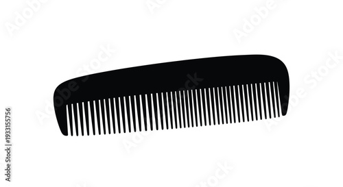 A black hair comb shown in a dark stark silhouette