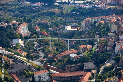 Elevated panoramic city view of Covilha with red rooftops and valley landscape in central Portugal, Portugal, Covilha, 16 October 2025