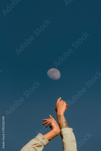 Human Hands Reaching for the Moon Concept