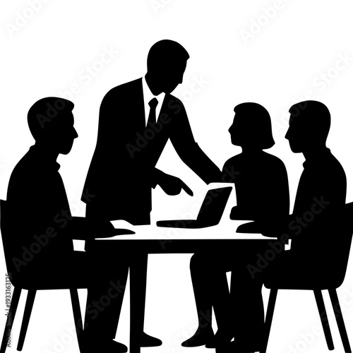 A group of people sitting around a table with a laptop