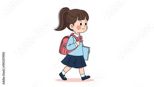 Happy elementary schoolgirl with a ponytail carrying a backpack and a blue book while walking to class on a simple white background.