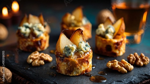 Savory-sweet variation featuring caramelized pear cubes folded into blue cheese filling, golden exterior with glossy tops, plated on slate board with walnut halves scattered around