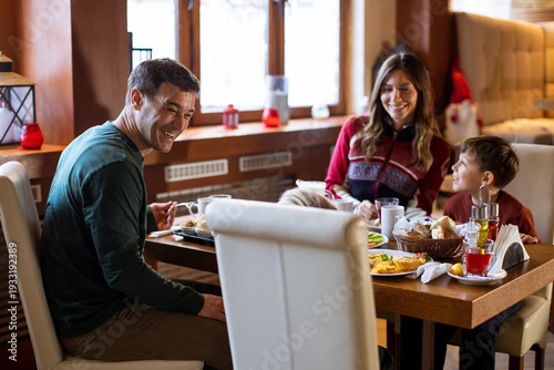 Family enjoys breakfast tog...