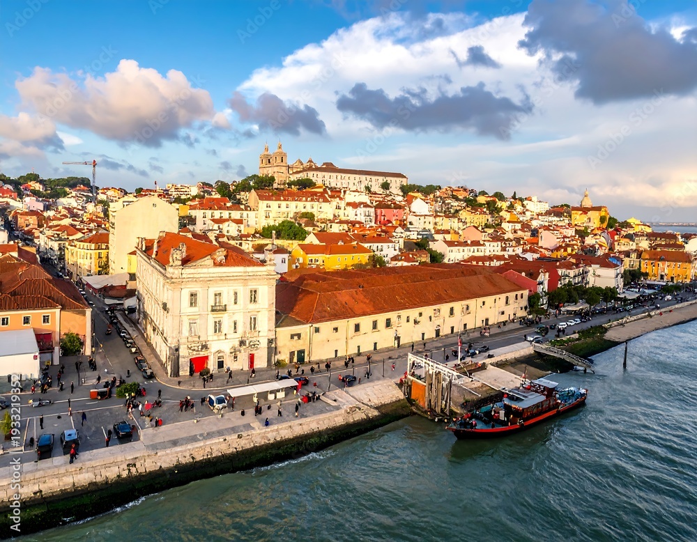 Obraz premium Lisbon cityscape waterfront buildings clouds.