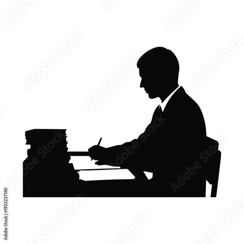 Businessman working diligently at office desk with documents