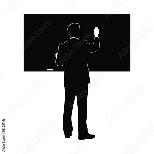 Businessman writing on blackboard in professional setting