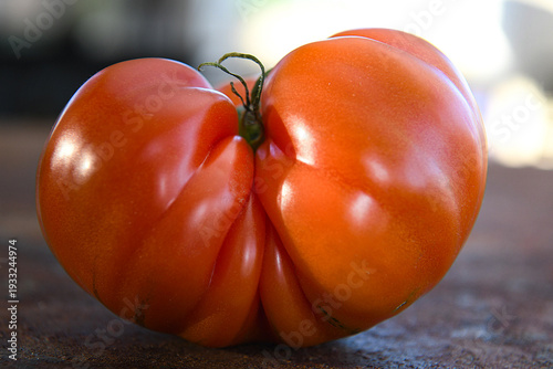 Heirloom tomato on a wooden background