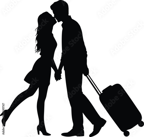 Black silhouette of a romantic young couple kissing while holding hands and pulling rolling luggage for honeymoon travel reunion and bittersweet departure lifestyle concepts.