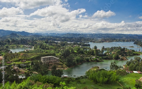 Stunning landscape of El Peñol Stone in Guatapé, Colombia. Iconic monolith with zigzag stairs and panoramic reservoir views. Ideal for travel, tourism, and South American nature photography.