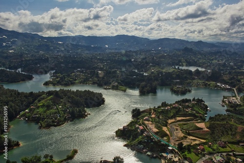 Stunning landscape of El Peñol Stone in Guatapé, Colombia. Iconic monolith with zigzag stairs and panoramic reservoir views. Ideal for travel, tourism, and South American nature photography.