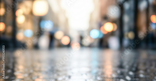 Wallpaper Mural Blurred view of a city street with reflections on wet pavement. City lights create a bokeh effect. A sense of urban life is present in the background. Torontodigital.ca