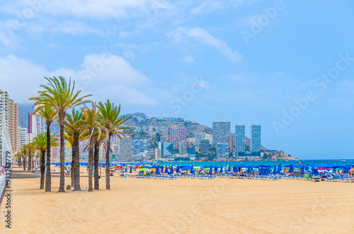 Levante sandy beach, Playa Platja De Llevant, embankment in Benidorm city centre, buildings on Costa Blanca coast Mediterranean Sea and Serra Gelada natural park mountain, Valencian Community, Spain