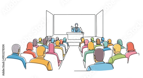 A speaker presenting to a seated audience in a simple lecture hall