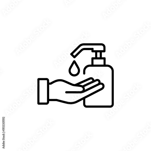 Hand under soap dispenser with a drop of liquid falling  hygiene concept
