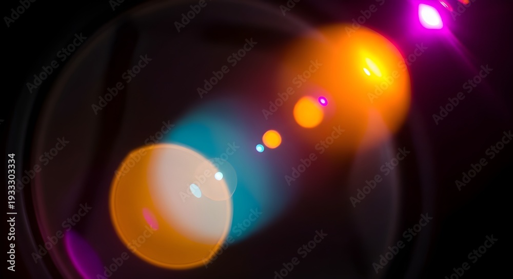 Fototapeta premium Blurry image of glowing orange and blue lights on dark background