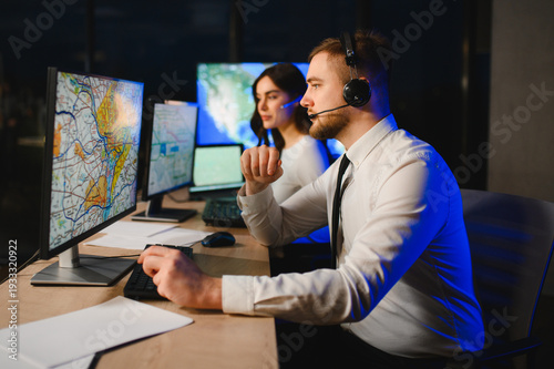 Dispatchers working late at night tracking logistics
