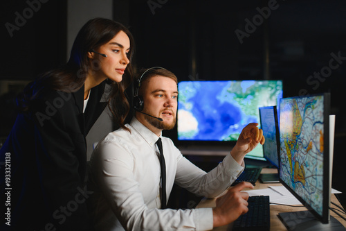 Team of dispatchers monitoring global logistics operations