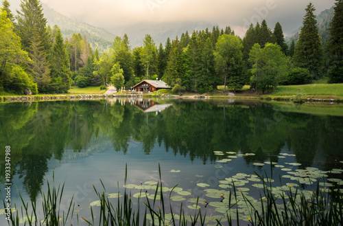 Chalet reflecting in an aline lake