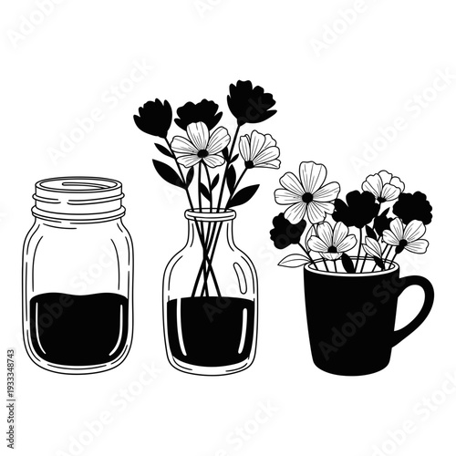 Colorful spring bouquet featuring pink daisies and orange gerber blossoms in a glass jar vase with green leaves isolated on a garden background