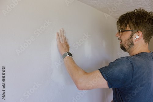 Inspecting Drywall Surface by Hand