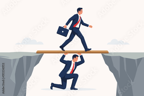 Businessman supporting his colleague by holding a bridge over a cliff gap for him to cross safely. Concept of teamwork, leadership, mutual help, business partnership, and overcoming challenges.