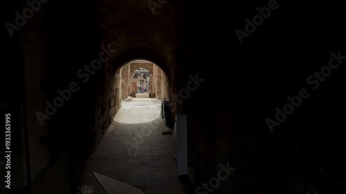 Tourist pov cinematic shot of Colosseum interior passage in Rome, Italy