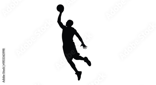 Silhouette of a basketball player in mid air preparing to shoot the ball