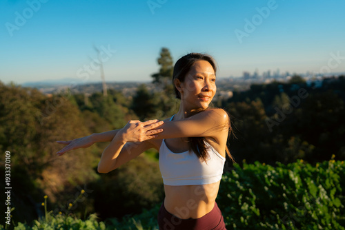 Woman stretches in sun
