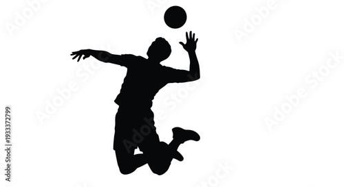 Silhouette of a basketball player in mid air preparing to shoot the ball