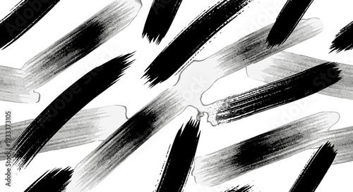 Abstract black brush strokes on white background.