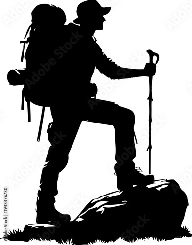 Silhouette of a determined backpacker wearing a hat and using a trekking pole while standing victoriously upon a large rock formation during an arduous journey