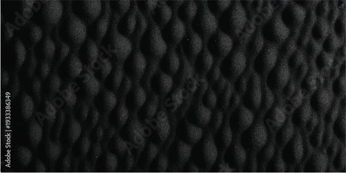 A dark black leather texture features a macro pattern of natural rough skin surface, creating a vintage material background for fashion and textile design