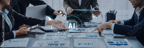 Fotografía A diverse business team collaborates in a modern office, using charts and technology to discuss AI strategies and innovations, fostering effective teamwork and planning