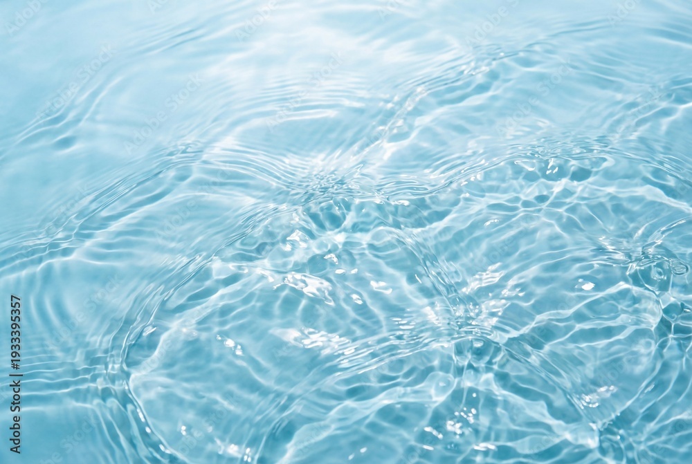 Obraz premium Fresh blue water surface texture with gentle waves and sunlight reflection for summer concepts