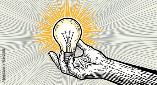 Hand holding a glowing light bulb with rays.