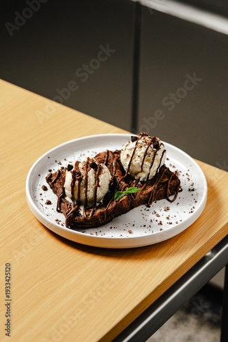 Chocolate Brownie Dessert with Ice Cream and Syrup Drizzle