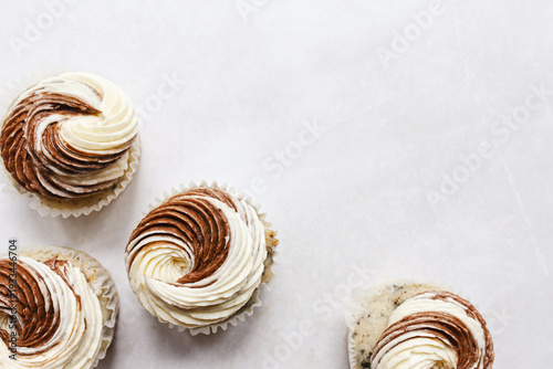 cupcakes with swirled vanilla and chocolate icing