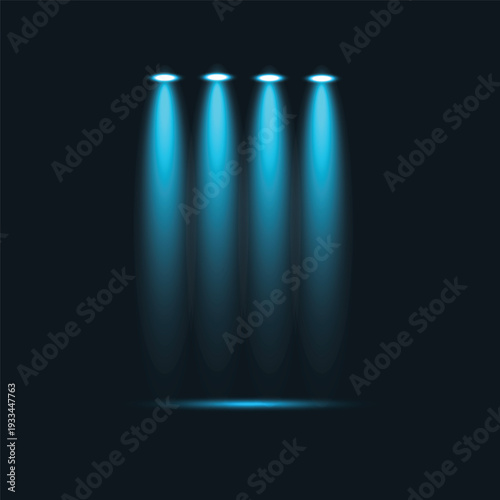 Four blue stage spotlights shining down on a dark background