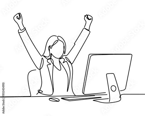 A woman celebrating success at her desk with her arms raised in triumph